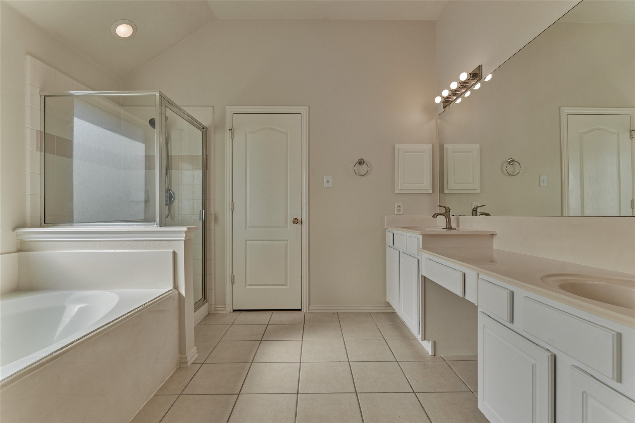21322 Hannover Forest Spring, TX 77388 - Photo 17 of 30 Primary bathroom shines with dual vanities, soaking tub, and walk-in shower.