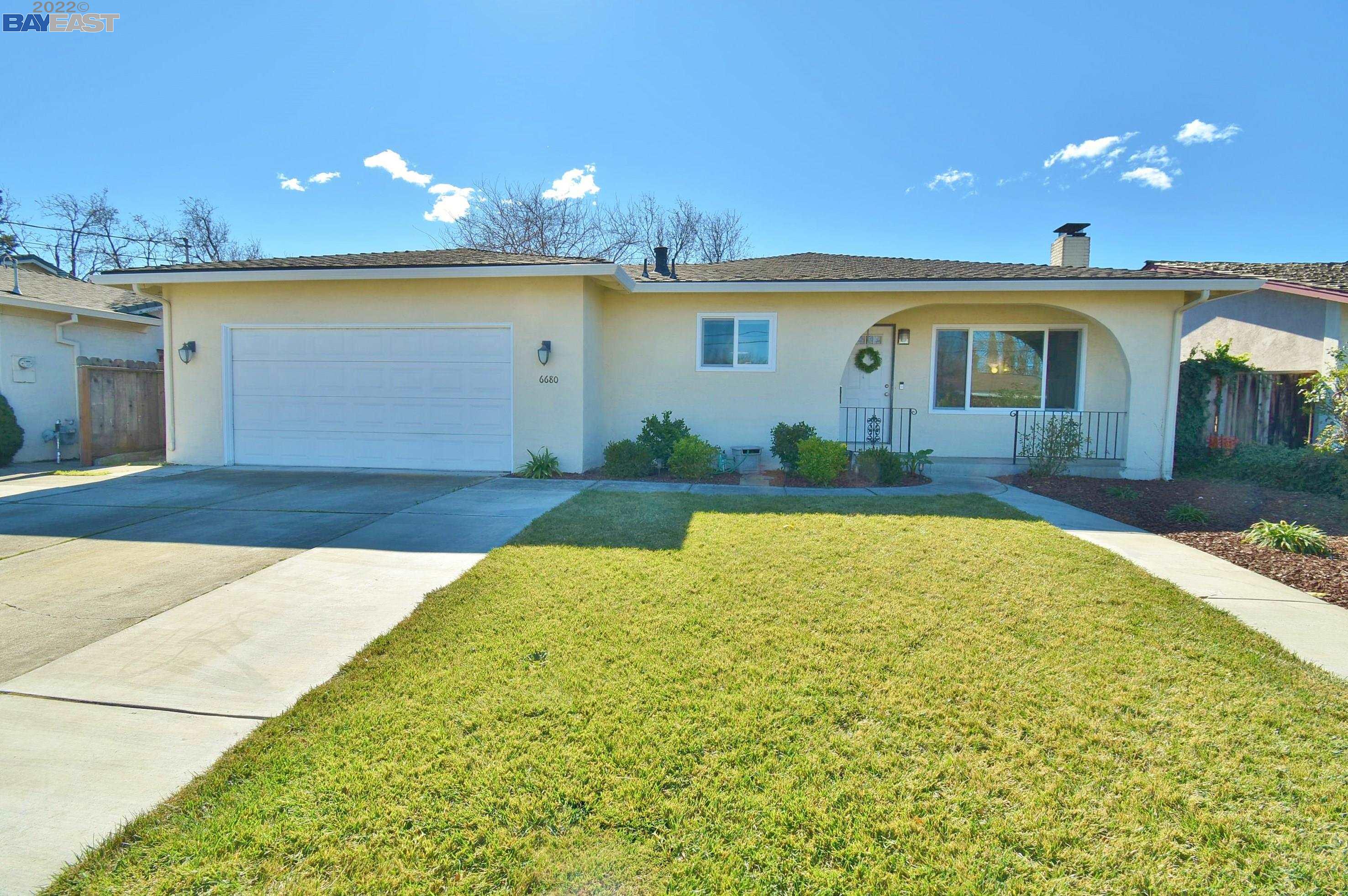 6680 Maple Drive Dublin, CA 94568 - Photo 1 of 1 a view of a house with a yard and potted plants