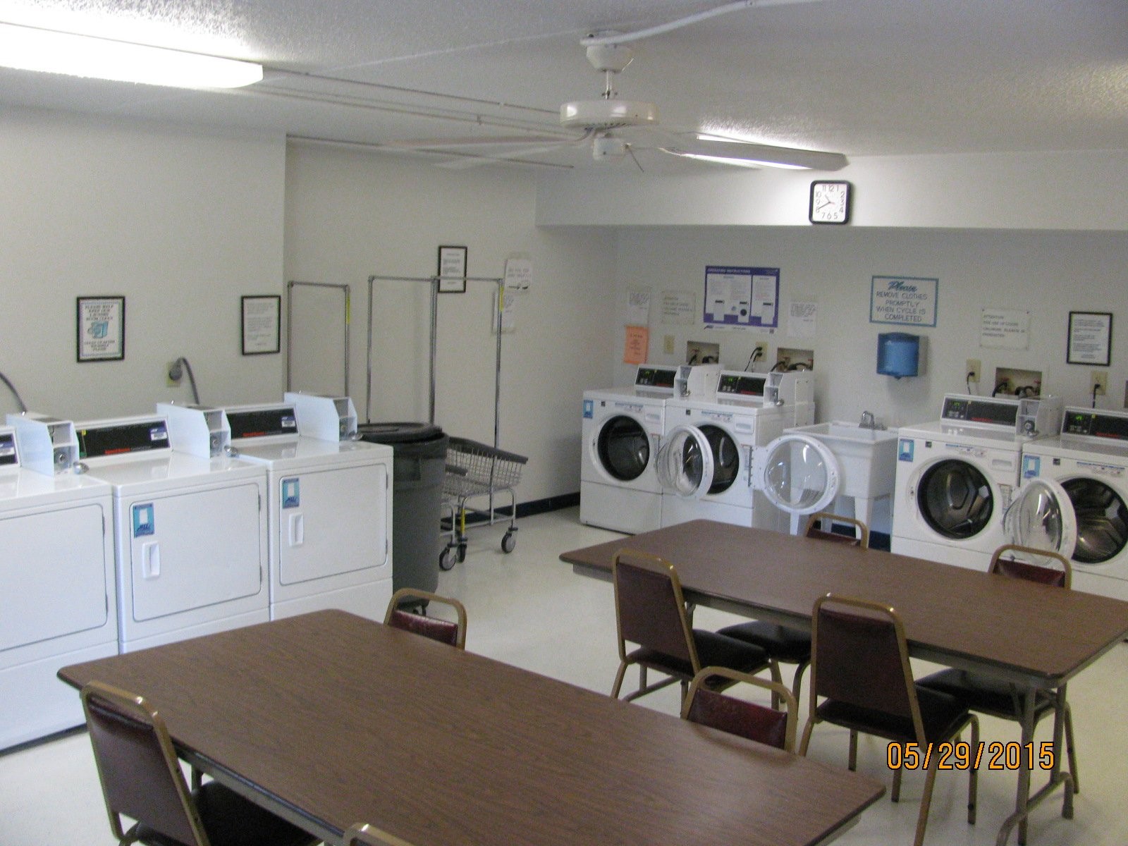 7988 North Michigan Road Indianapolis, IN 46268 - Photo 11 of 11 a workspace with kitchen island a stove a table and chairs