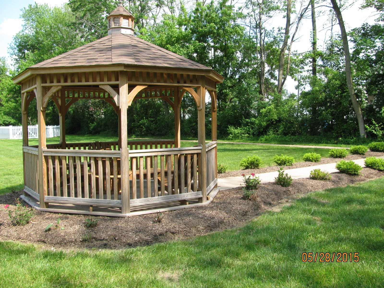7988 North Michigan Road Indianapolis, IN 46268 - Photo 3 of 11 a view of a chair and table in the garden