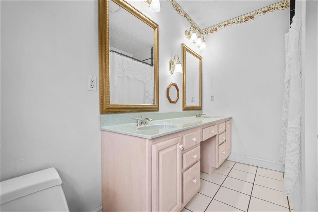 1315 South Main Street Burgettstown, PA 15021 - Photo 19 of 24 a bathroom with a granite countertop sink and a mirror