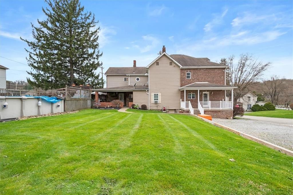 1315 South Main Street Burgettstown, PA 15021 - Photo 22 of 24 a front view of house with yard and green space
