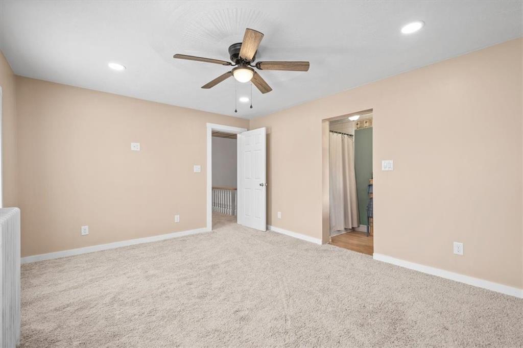 1315 South Main Street Burgettstown, PA 15021 - Photo 8 of 24 a view of an empty room with a ceiling fan