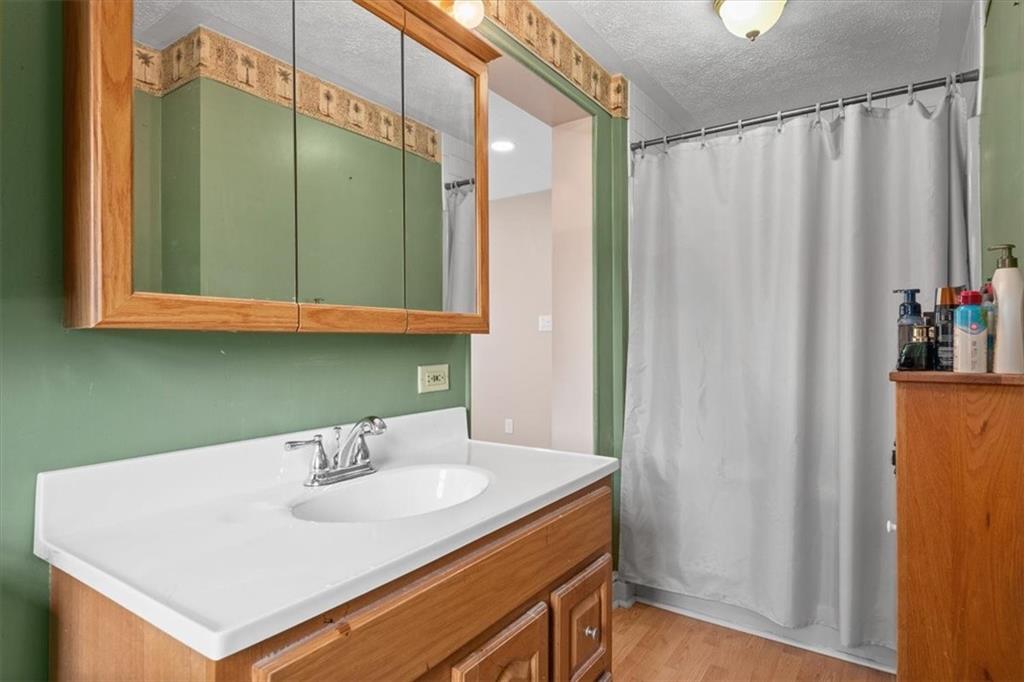 1315 South Main Street Burgettstown, PA 15021 - Photo 9 of 24 a bathroom with a sink and a mirror