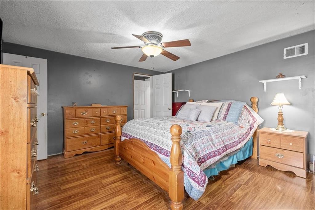 1315 South Main Street Burgettstown, PA 15021 - Photo 10 of 24 a bedroom with a bed and a chandelier