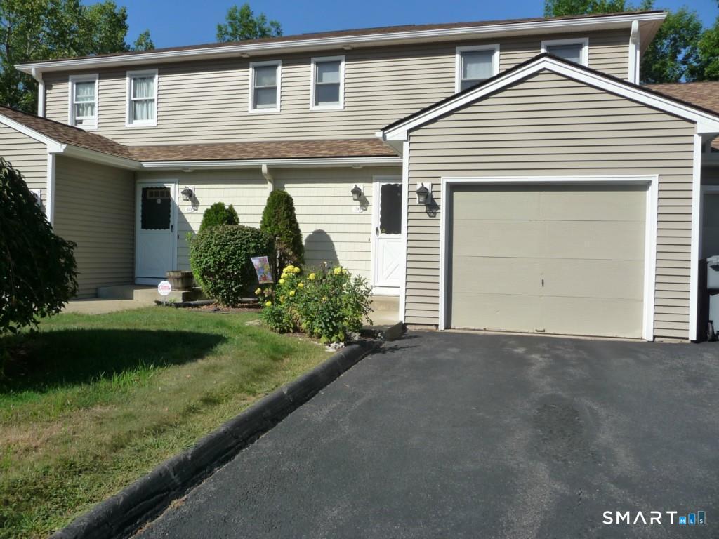 59 Brookside Village, Unit 59 Enfield, CT 06082 - Photo 1 of 1 a view of a house with yard and plants