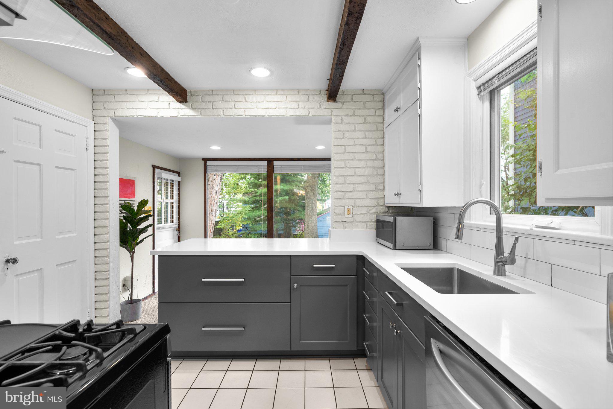 807 Islington Street Silver Spring, MD 20910 - Photo 12 of 49 Renovated Kitchen with quartz countertops