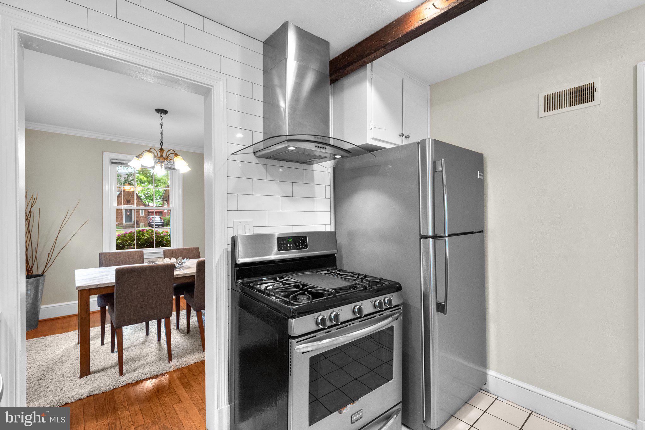 807 Islington Street Silver Spring, MD 20910 - Photo 17 of 49 Gas Range + Hood that vents to the exterior