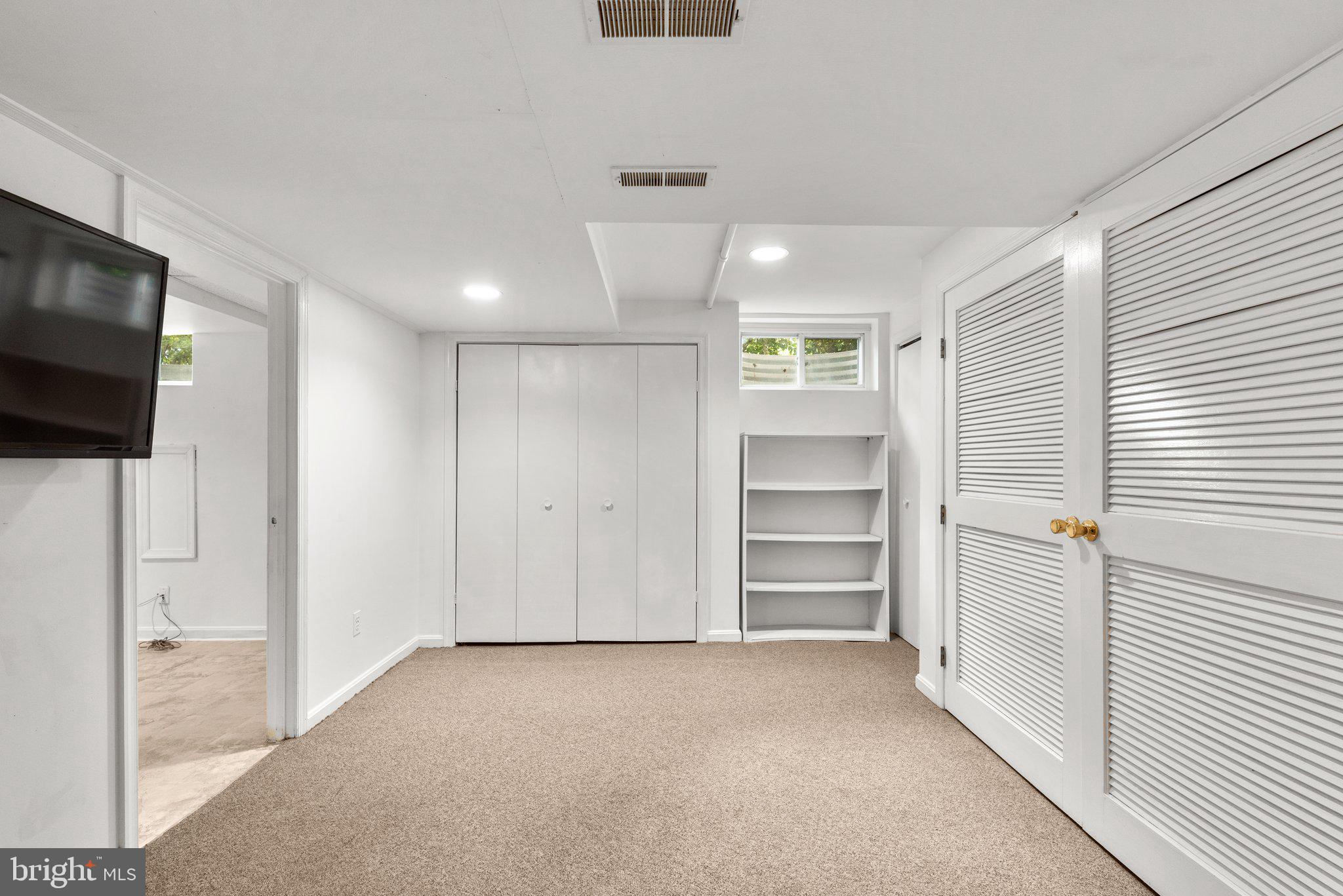 807 Islington Street Silver Spring, MD 20910 - Photo 33 of 49 Lower Level Family Room with Carpet + Utility Room