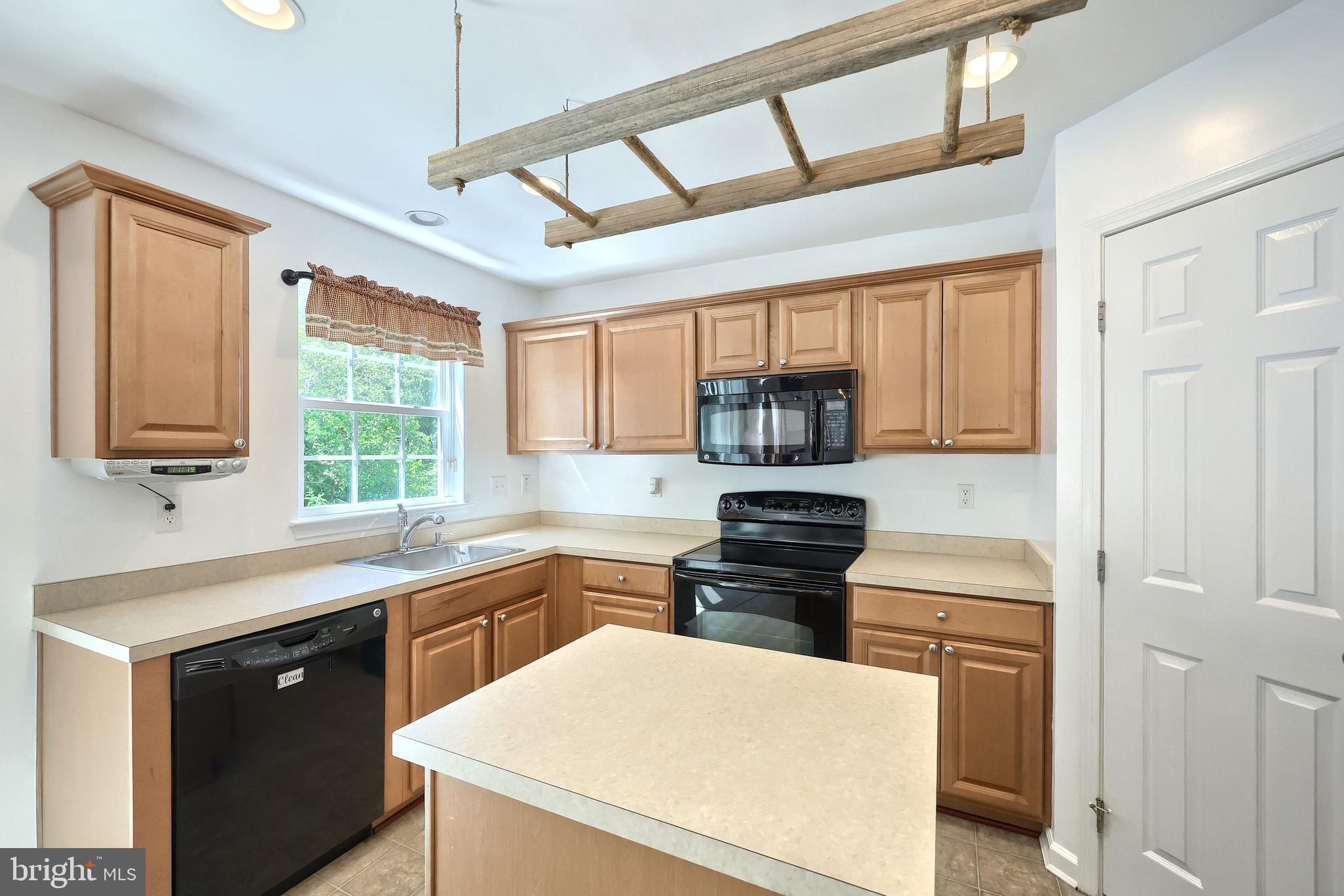 425 Lakeview Drive Spring Grove, PA 17362 - Photo 25 of 51 a kitchen with stainless steel appliances sink stove and refrigerator
