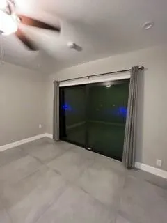 a view of a livingroom with a ceiling fan