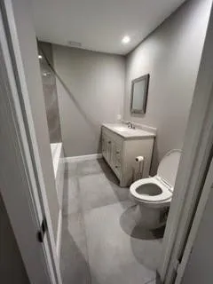 a bathroom with a bathtub and shower