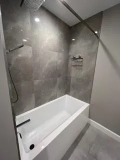 a bathroom with a sink and mirror