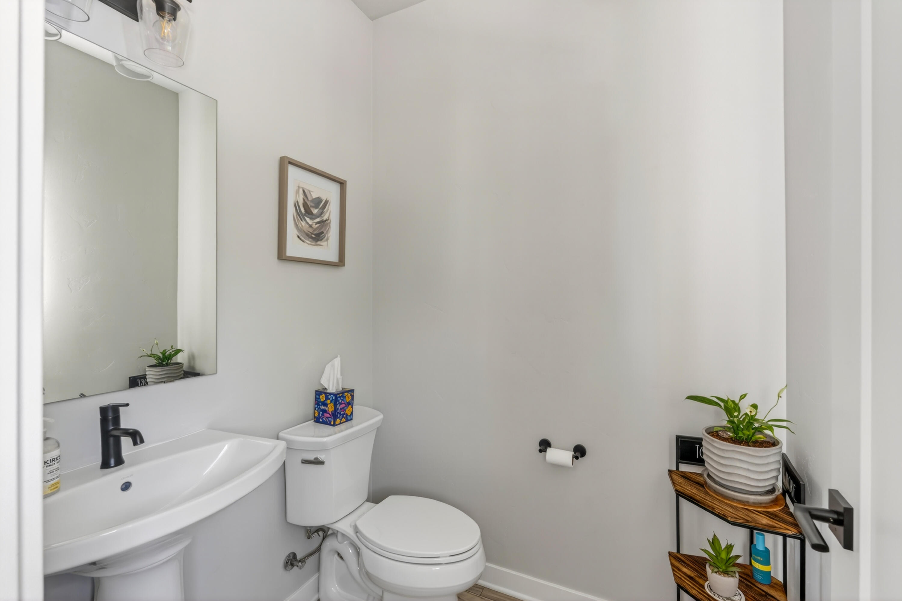 4572 Southwest 37th Street Redmond, OR 97756 - Photo 16 of 19 a white toilet sitting next to a bathroom sink