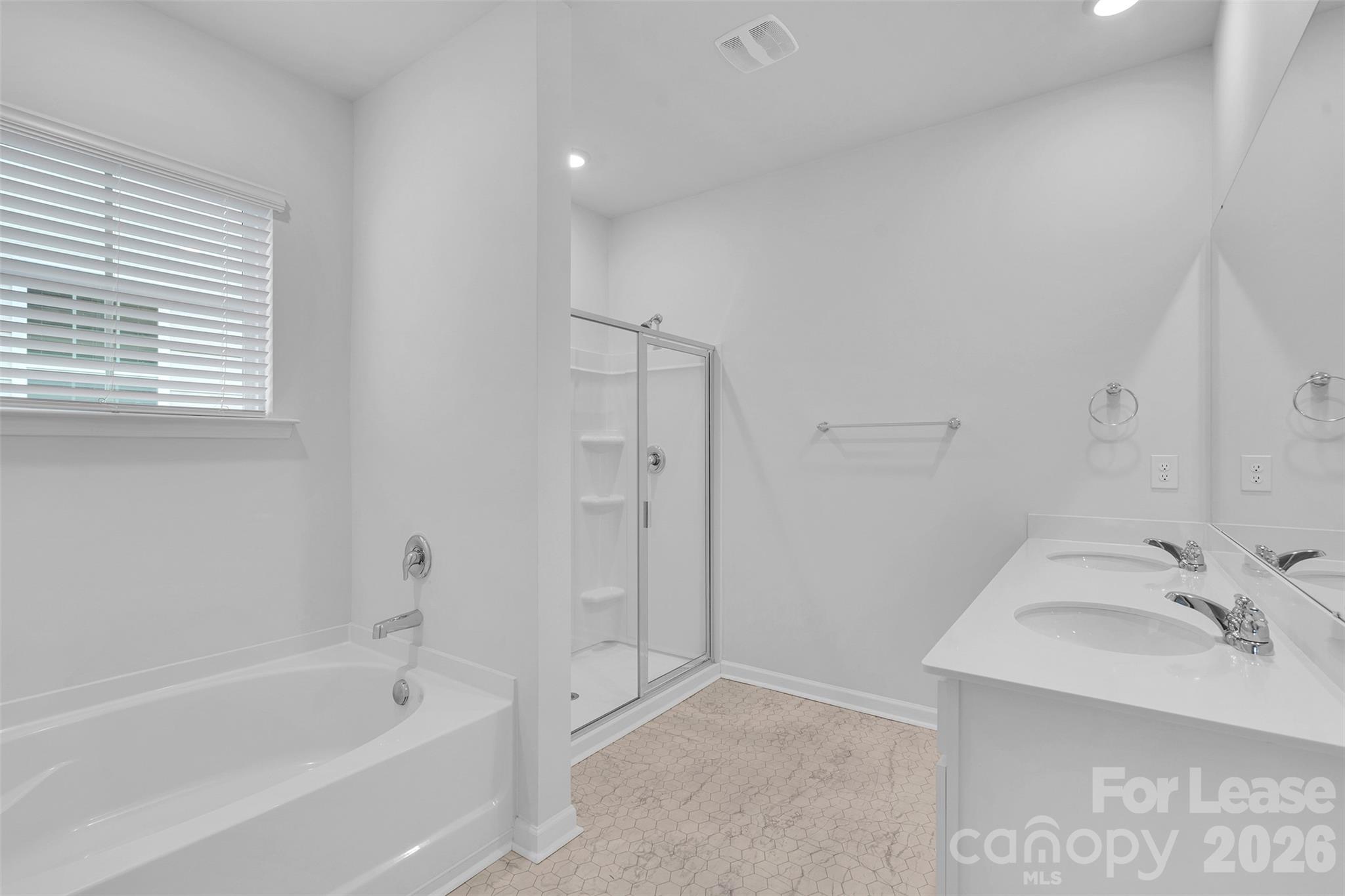 1917 Vanderlyn Street Monroe, NC 28112 - Photo 11 of 14 a bathroom with a bathtub and a sink