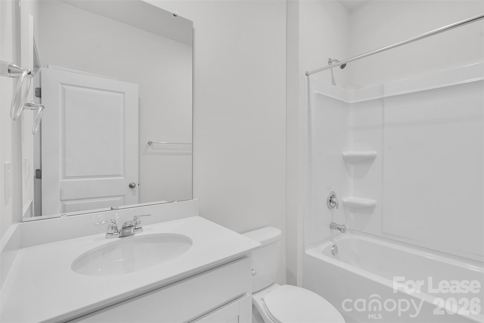 1917 Vanderlyn Street Monroe, NC 28112 - Photo 12 of 14 a bathroom with a bathtub shower sink vanity and a toilet