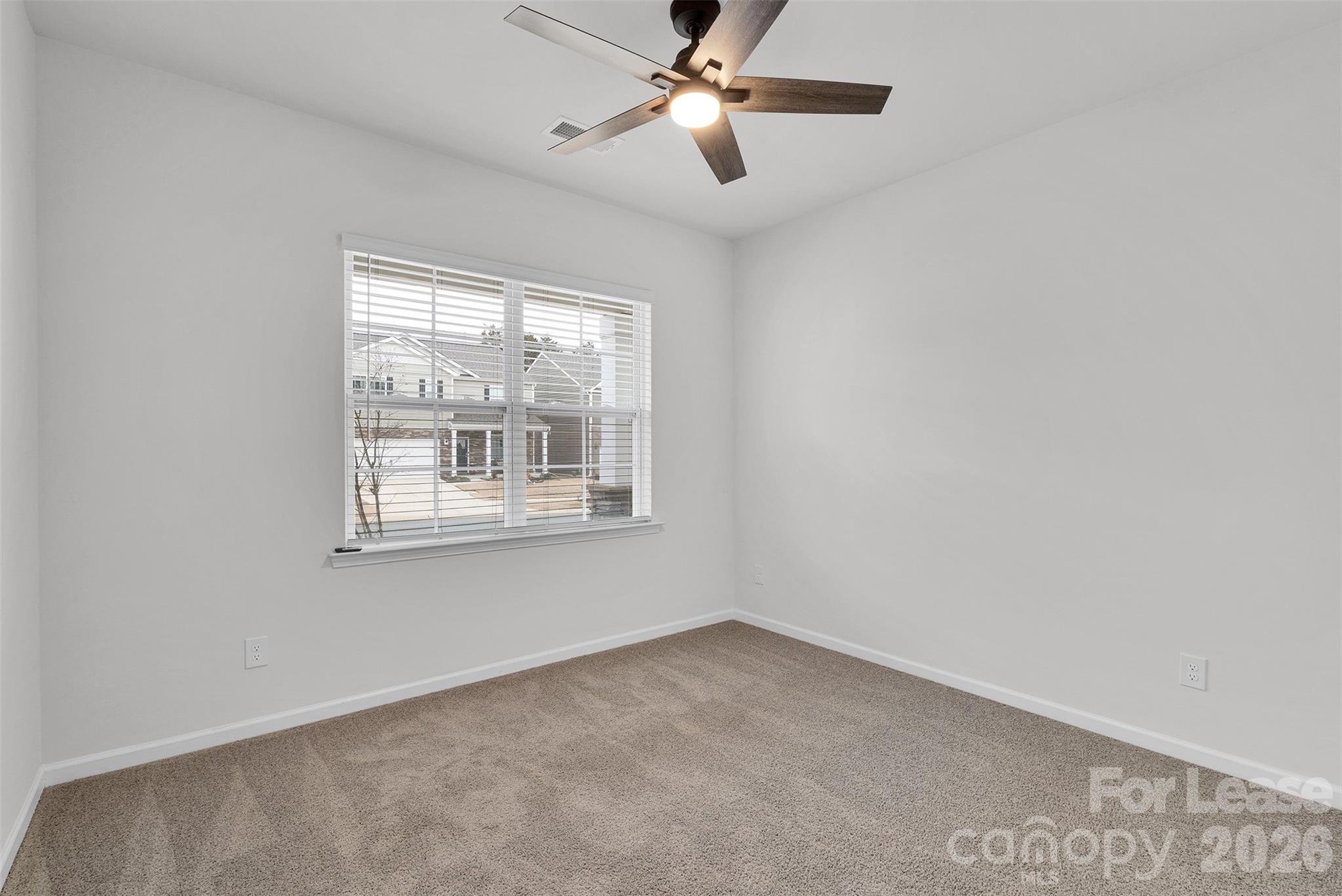 1917 Vanderlyn Street Monroe, NC 28112 - Photo 6 of 14 a view of an empty room with a window