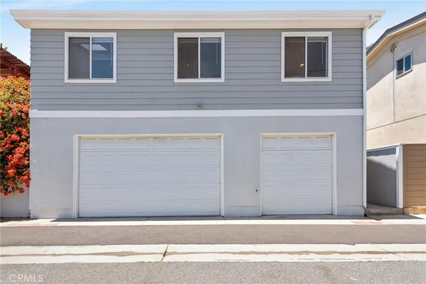 front view of a house with a tree