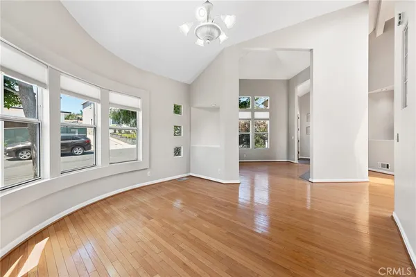 a kitchen with white cabinets a sink and white appliances