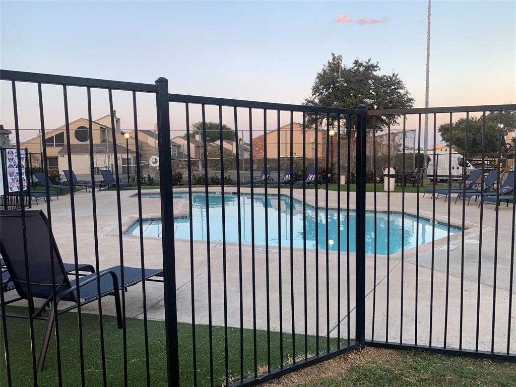 12482 Abrams Road, Unit 1303 Dallas, TX 75243 - Photo 3 of 30 Gated swimming pool with surrounding concrete decking, and multiple lounge chairs