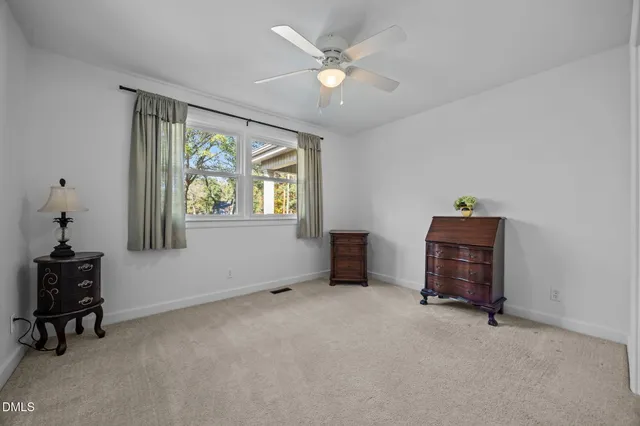 an empty room with a mirror