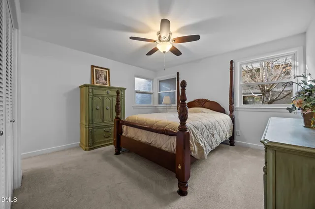 a bed room with a bed and a chandelier