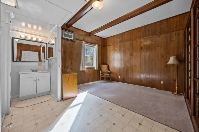 a bathroom with a shower sink and mirror