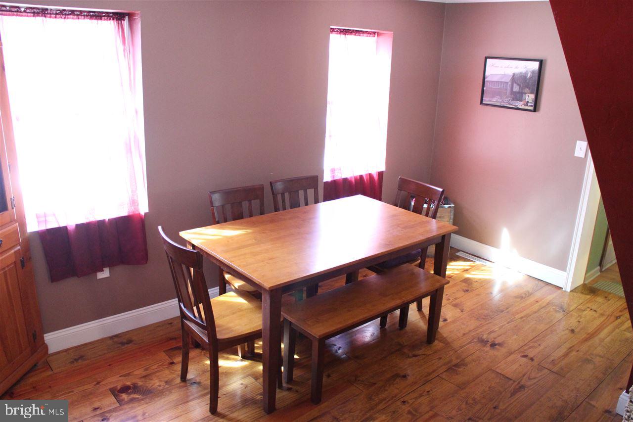 865 Bremer Road Dover, PA 17315 - Photo 12 of 33 a view of a dining room with furniture and wooden floor
