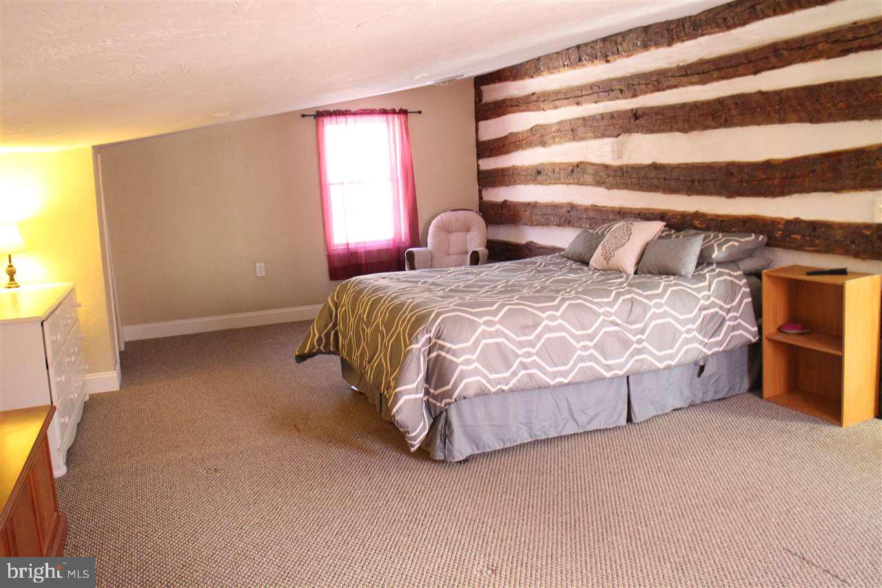865 Bremer Road Dover, PA 17315 - Photo 13 of 33 a spacious bedroom with a bed and a window