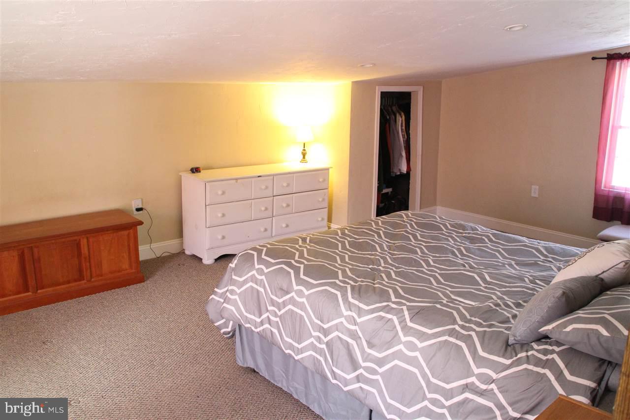 865 Bremer Road Dover, PA 17315 - Photo 15 of 33 a bedroom with a bed and a cabinets
