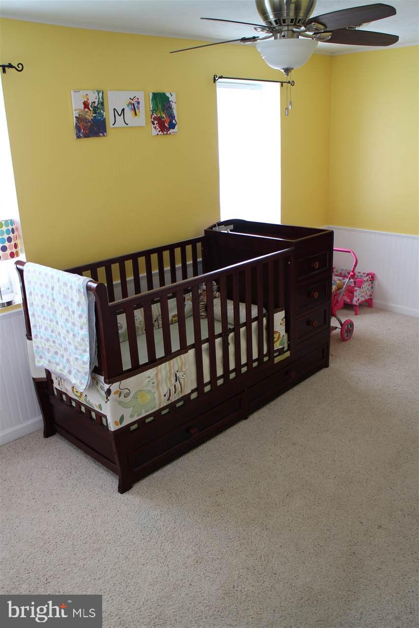 865 Bremer Road Dover, PA 17315 - Photo 16 of 33 a bed sitting in a bedroom next to a window