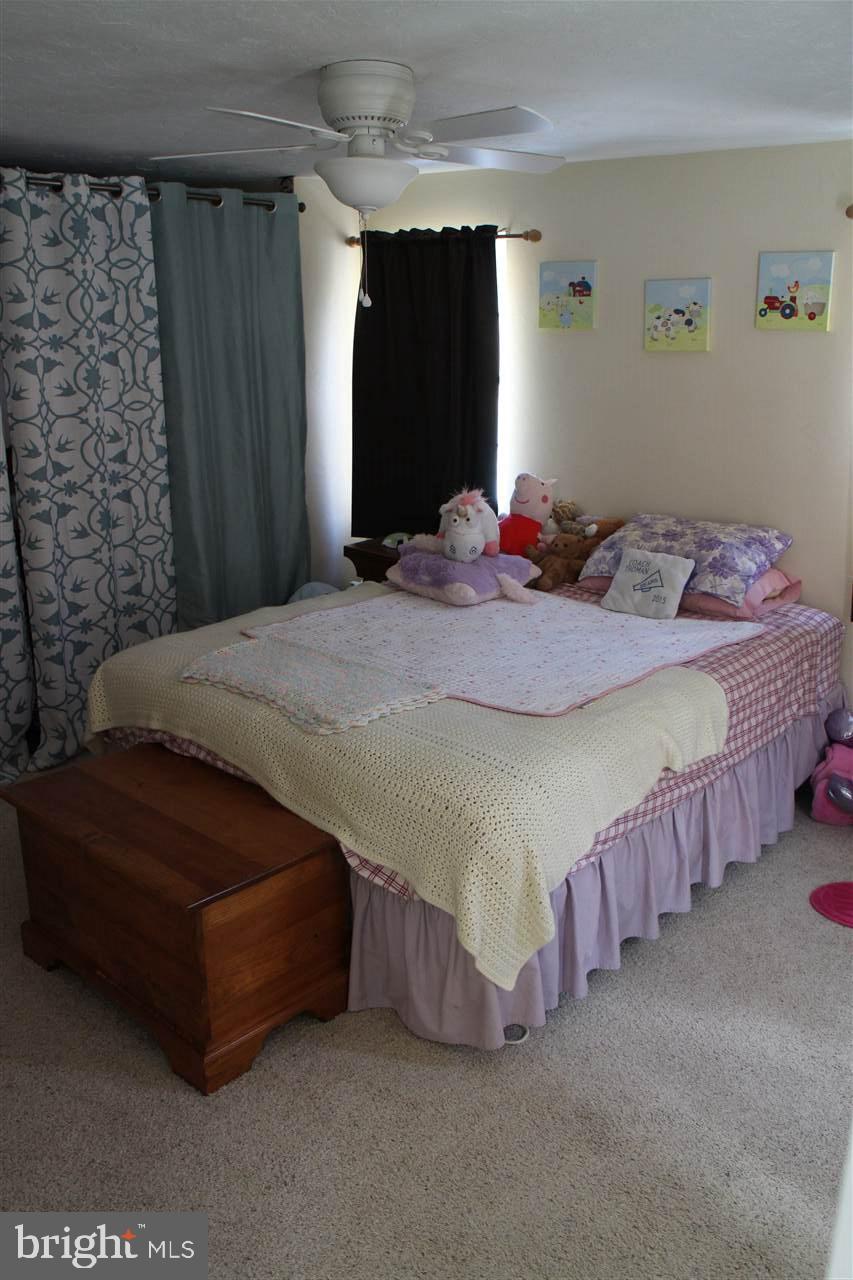865 Bremer Road Dover, PA 17315 - Photo 18 of 33 a bed sitting in a bedroom and closet