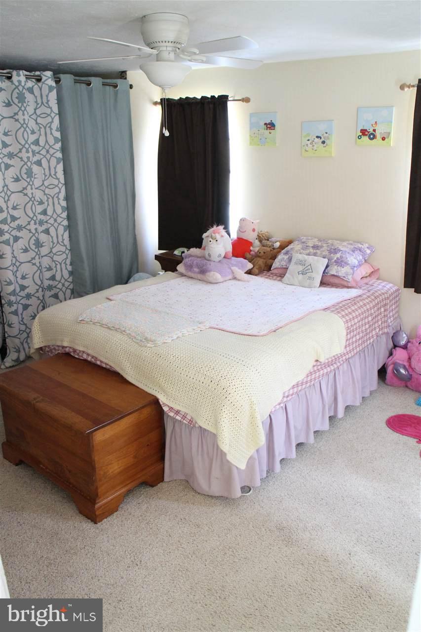 865 Bremer Road Dover, PA 17315 - Photo 19 of 33 a bedroom with a bed and a table