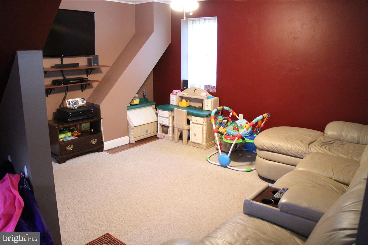 865 Bremer Road Dover, PA 17315 - Photo 4 of 33 a living room with furniture and a flat screen tv