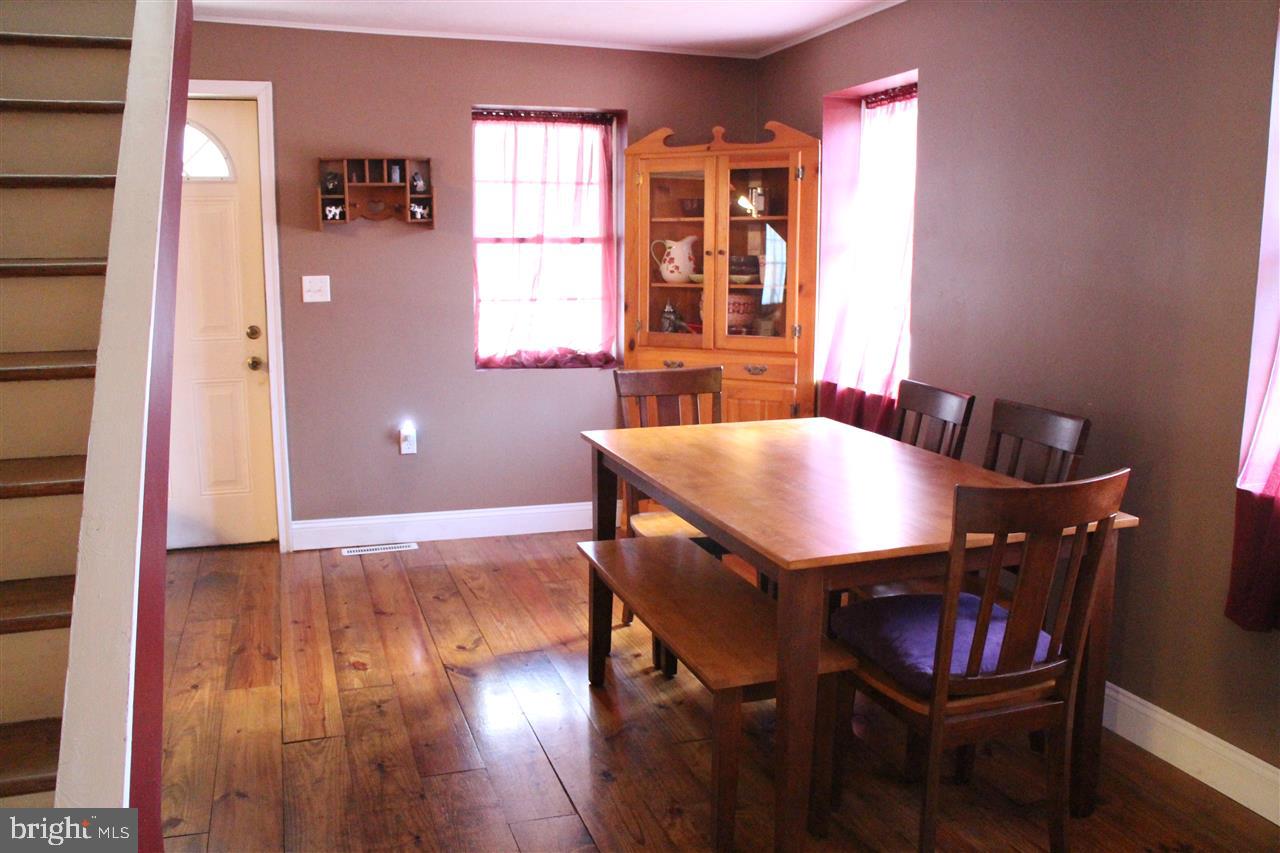 865 Bremer Road Dover, PA 17315 - Photo 10 of 33 a view of a dining room with furniture and wooden floor