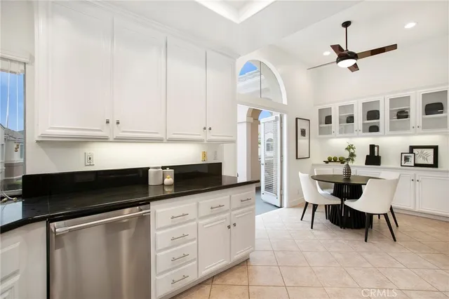 a kitchen with stainless steel appliances a stove a sink and a microwave