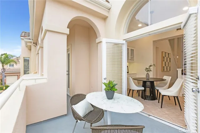 a view of a chairs and table in a patio