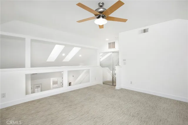 a bathroom with a shower a mirror and a sink