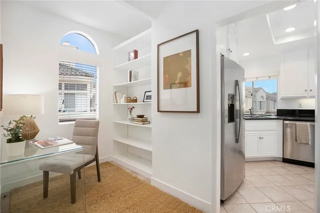a bed room with a bed and a potted plant