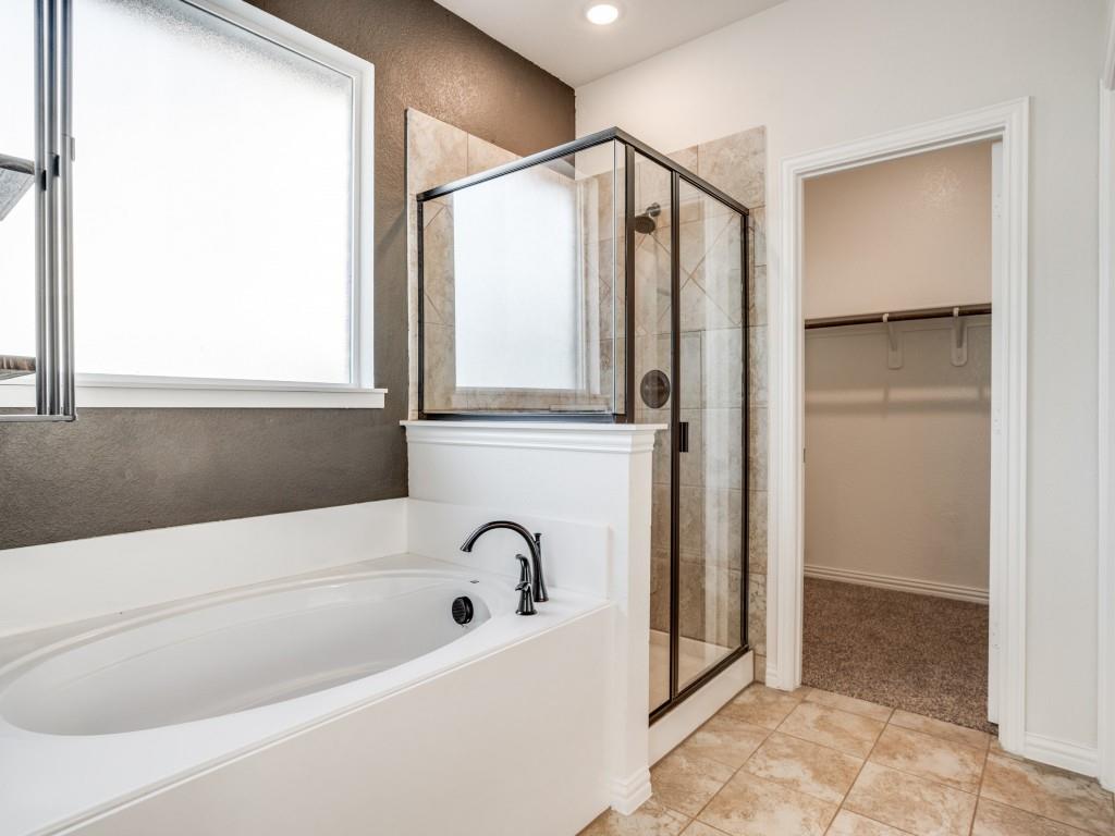3225 Greymoore Drive Anna, TX 75409 - Photo 12 of 16 a bathroom with a bathtub and a shower