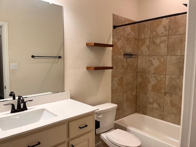3225 Greymoore Drive Anna, TX 75409 - Photo 14 of 16 a bathroom with a sink toilet and shower
