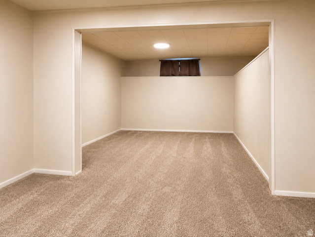 1766 Kenilworth Road Spring Glen, UT 84526 - Photo 12 of 24 Carpeted room with neutral-toned walls, a drop ceiling, and a recessed light fixture