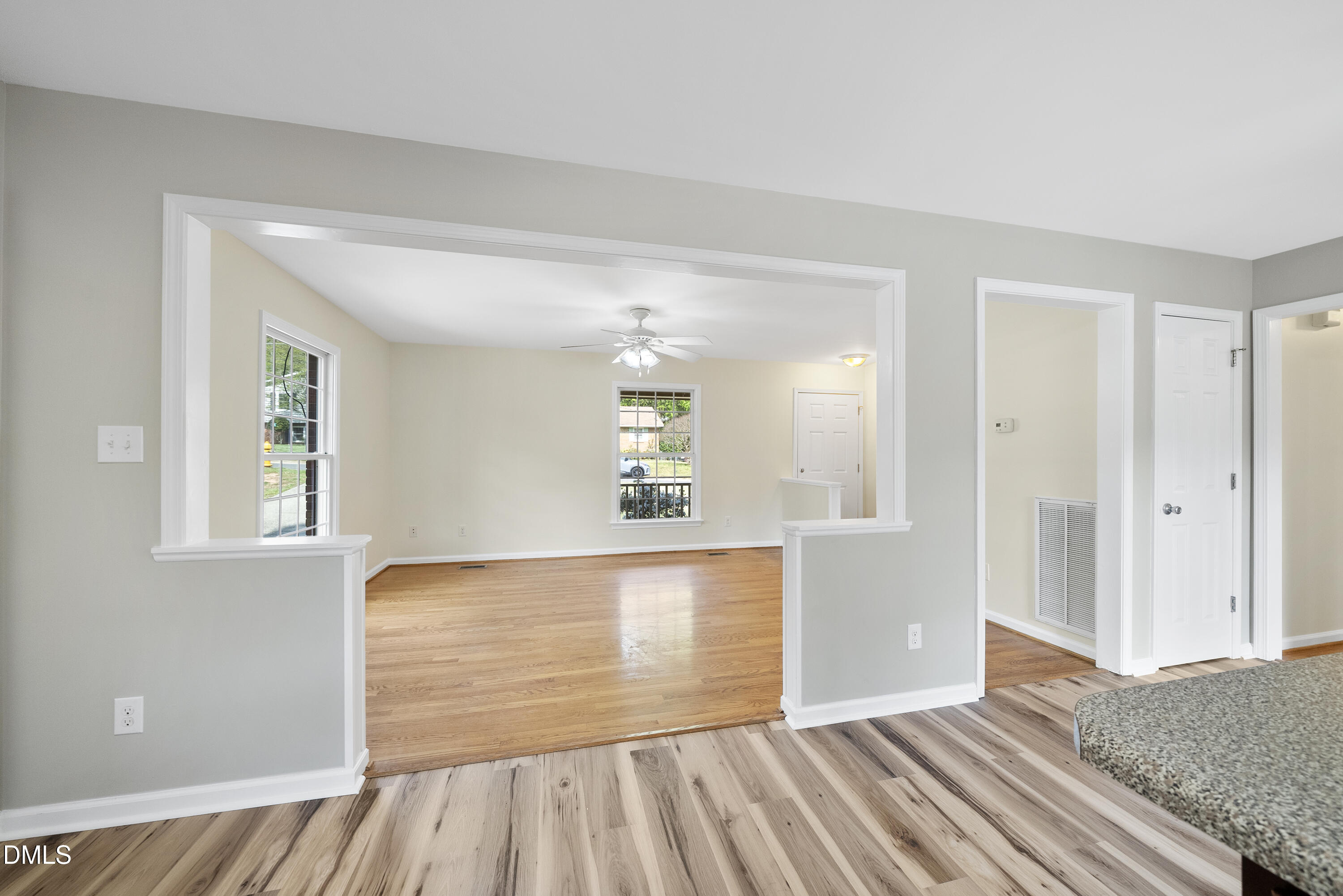 2123 Shenandoah Road Raleigh, NC 27603 - Photo 12 of 26 an empty room with wooden floor and windows