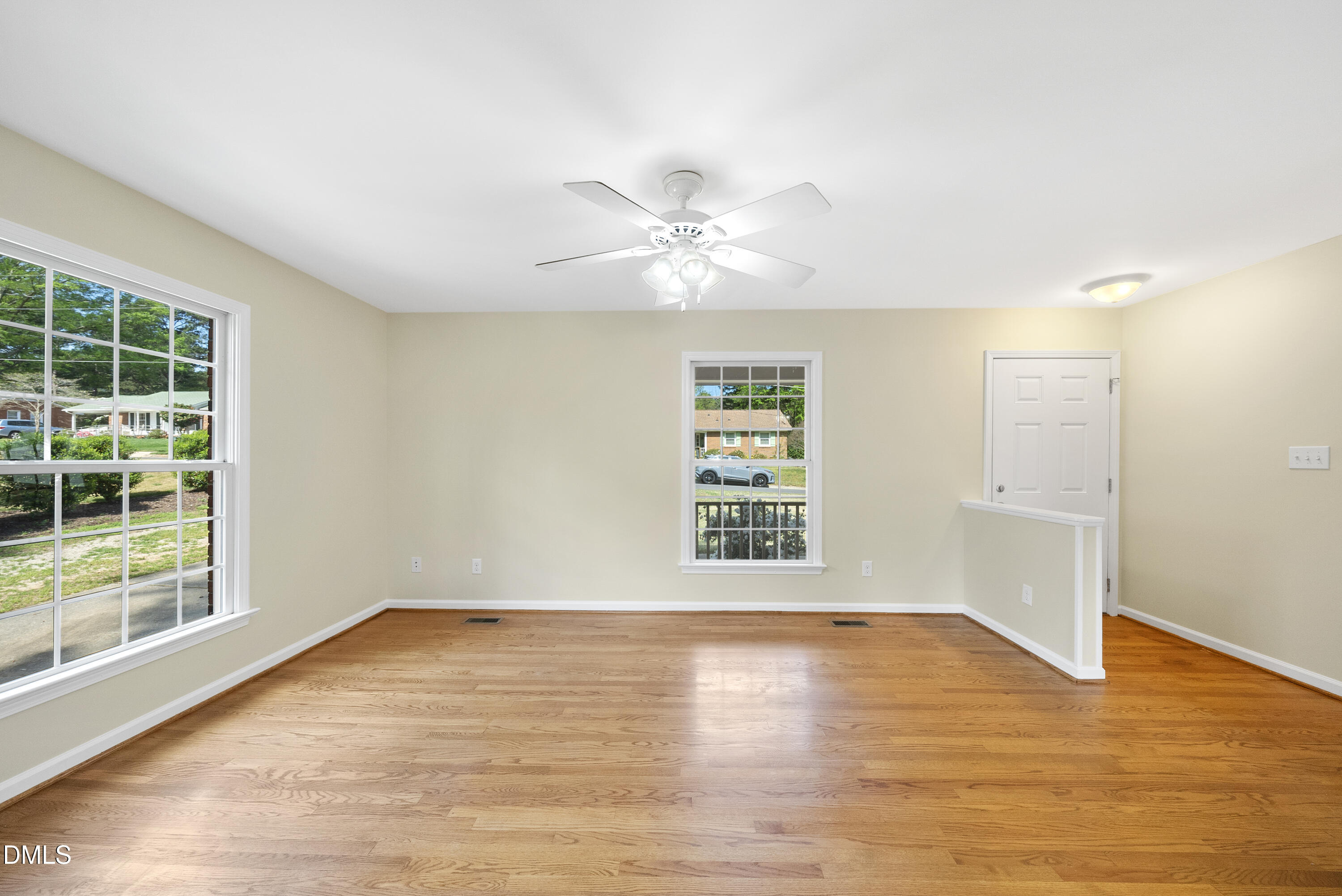 2123 Shenandoah Road Raleigh, NC 27603 - Photo 14 of 26 a view of an empty room with wooden floor and a window