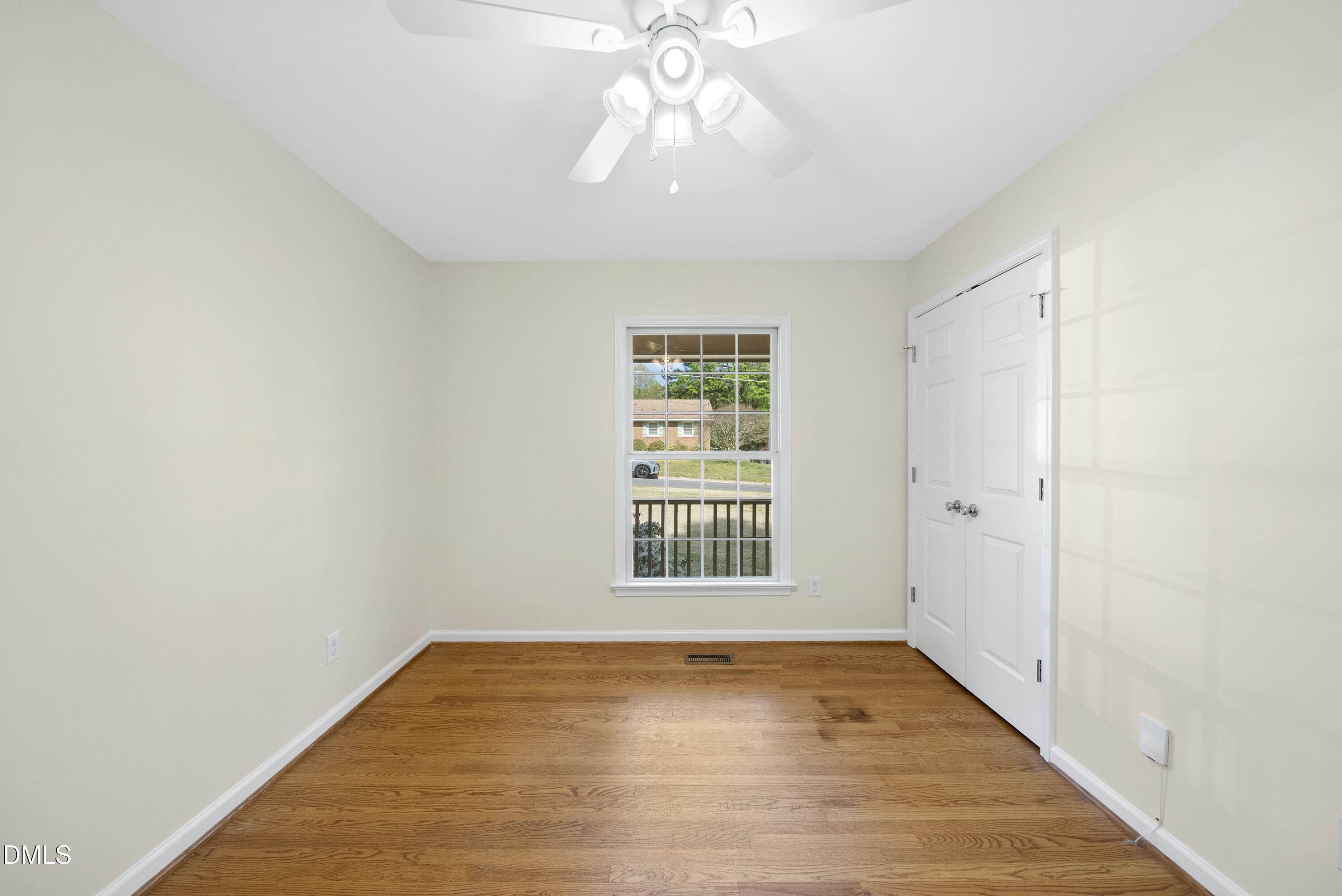 2123 Shenandoah Road Raleigh, NC 27603 - Photo 19 of 26 a view of an empty room with wooden floor and a window