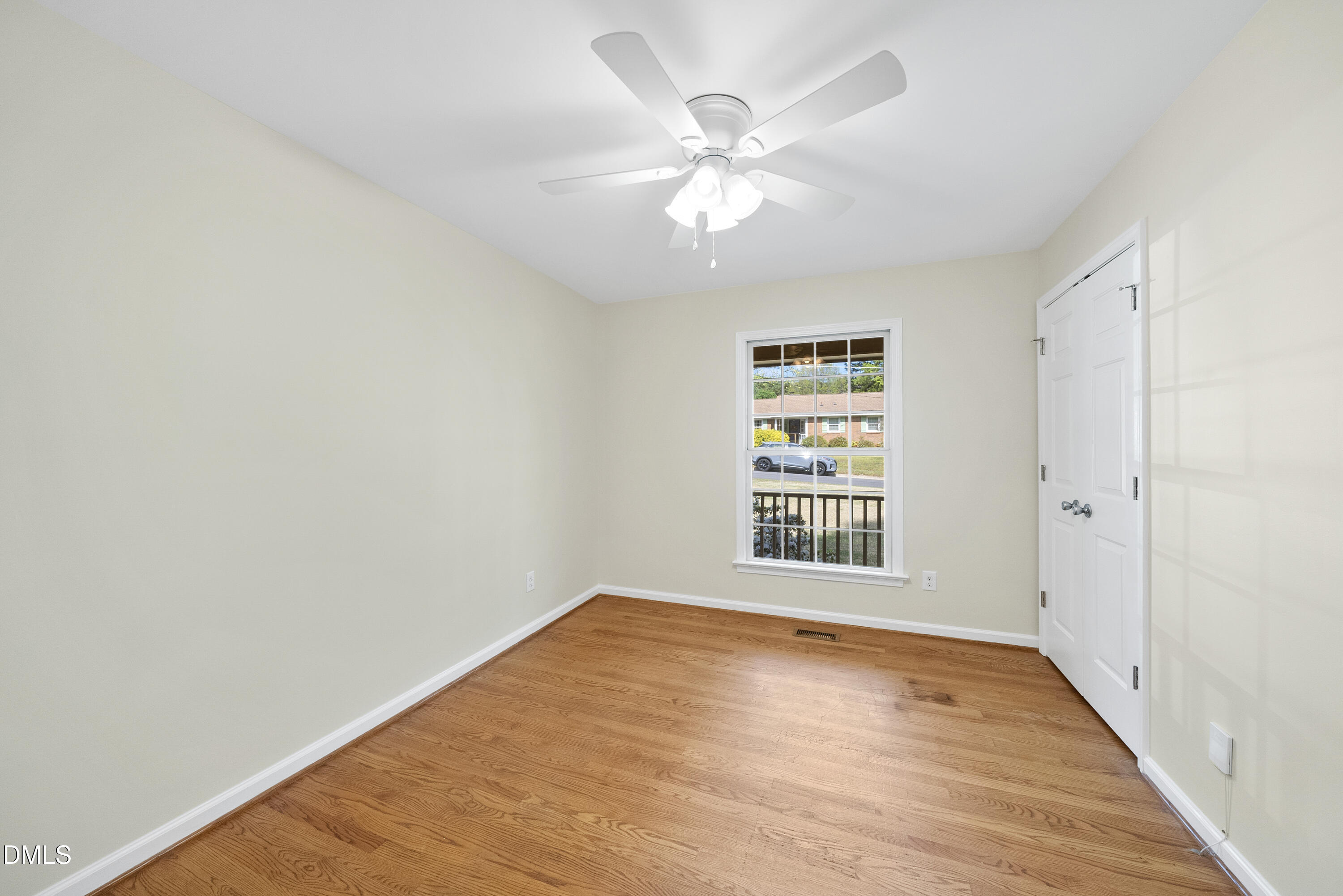 2123 Shenandoah Road Raleigh, NC 27603 - Photo 20 of 26 a view of an empty room with wooden floor and a window