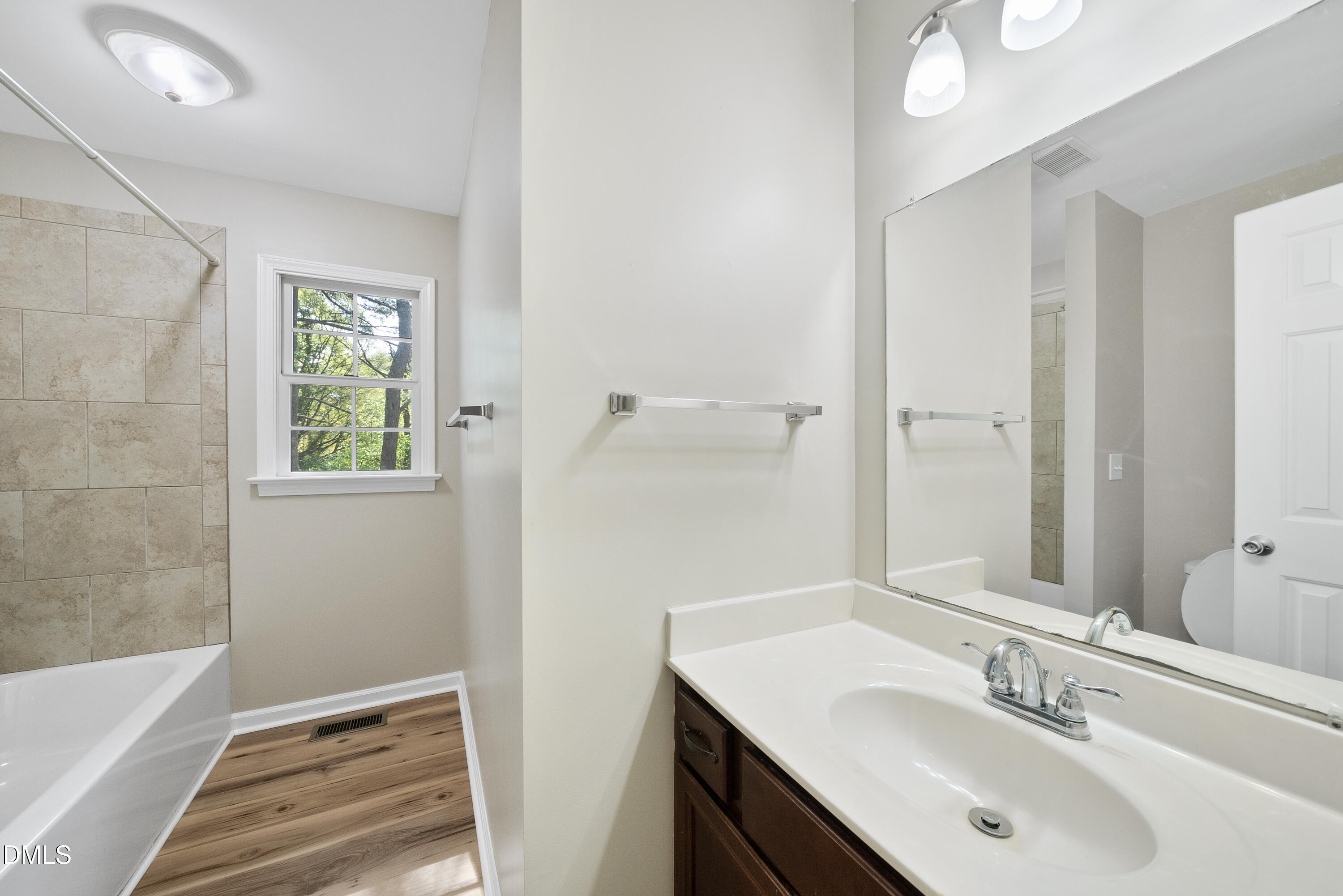 2123 Shenandoah Road Raleigh, NC 27603 - Photo 21 of 26 a bathroom with a sink and a mirror
