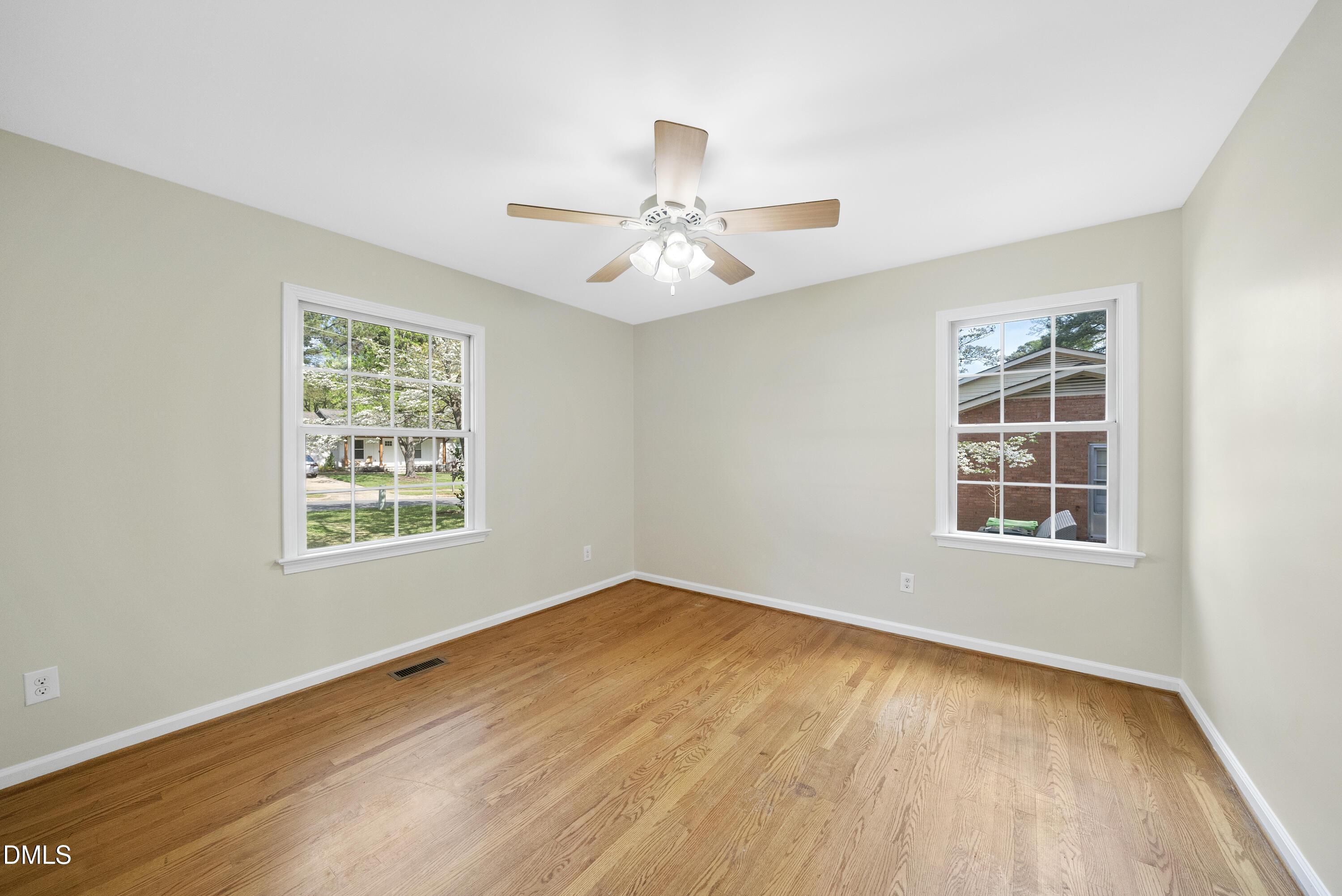 2123 Shenandoah Road Raleigh, NC 27603 - Photo 22 of 26 a view of an empty room with a window and wooden floor