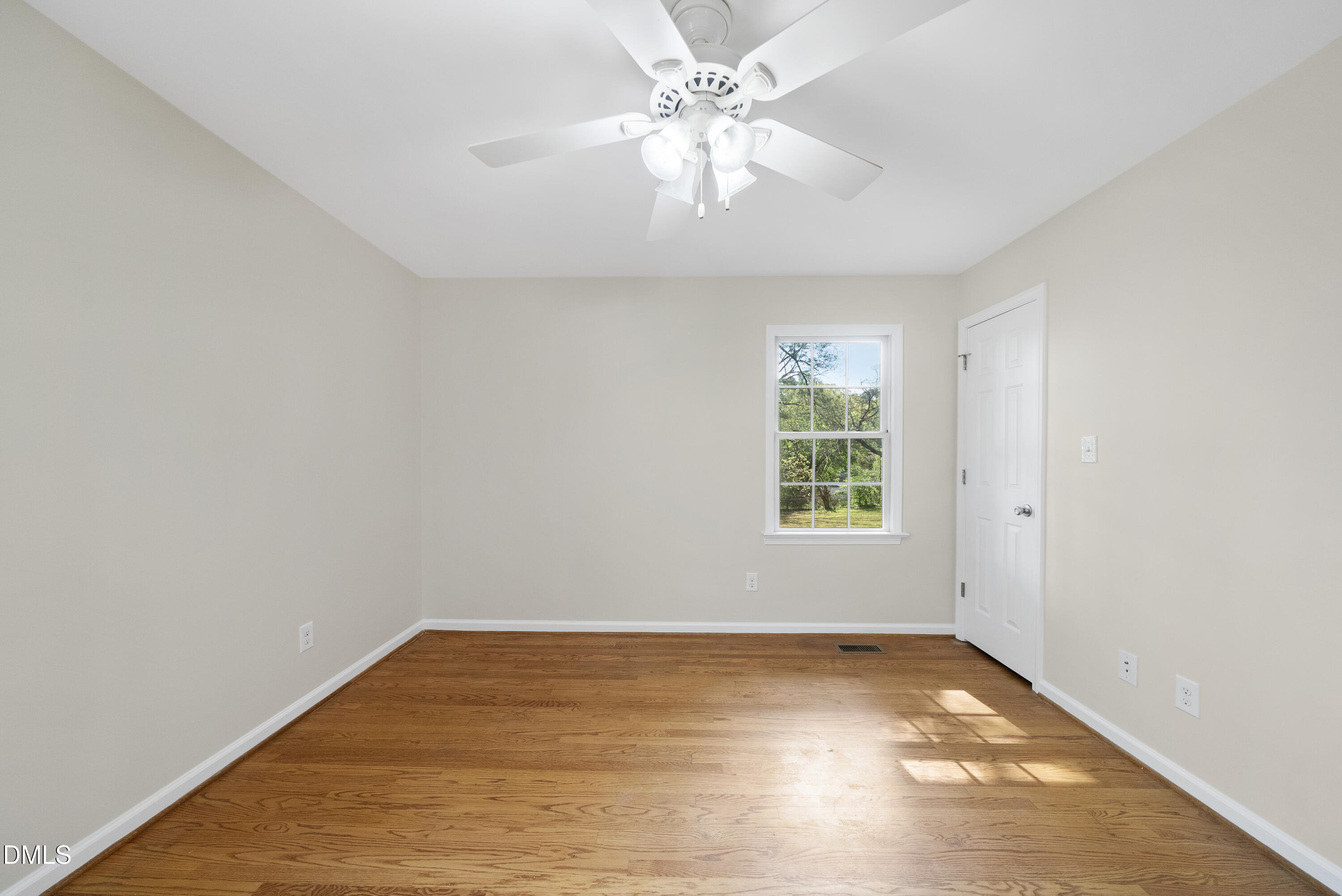 2123 Shenandoah Road Raleigh, NC 27603 - Photo 25 of 26 an empty room with a window and a ceiling fan