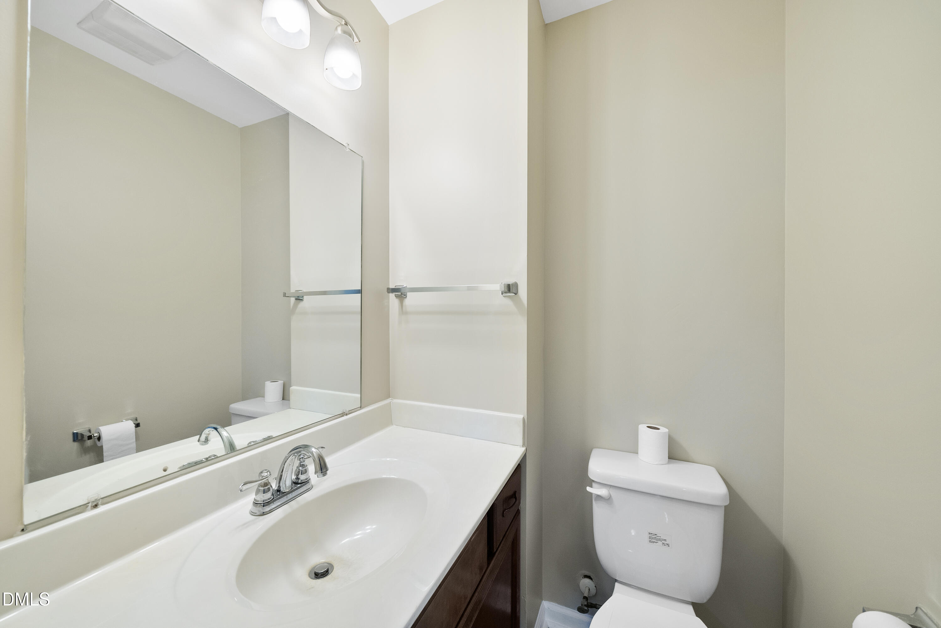 2123 Shenandoah Road Raleigh, NC 27603 - Photo 26 of 26 a bathroom with a sink toilet and vanity